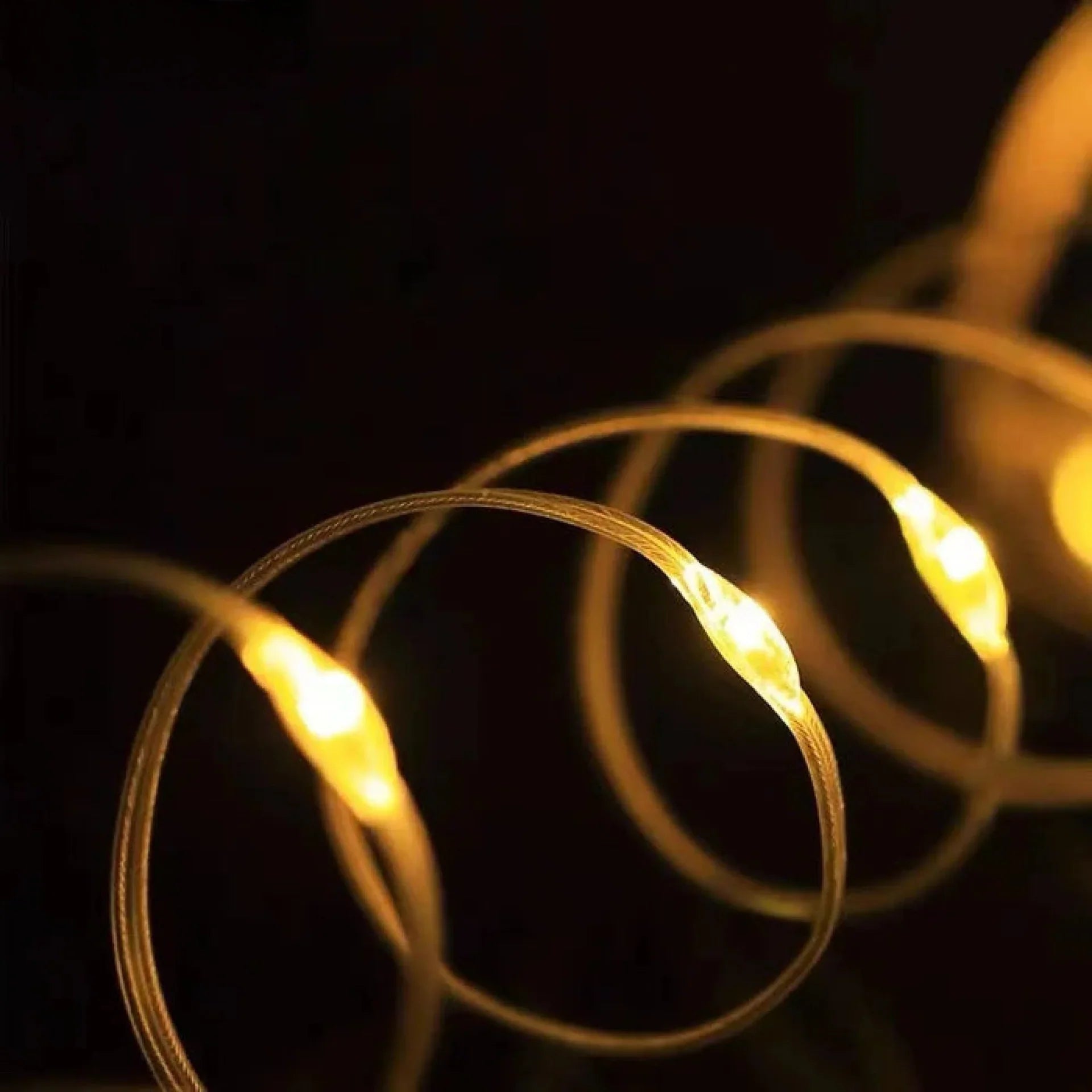 Close up of warm LED fireflies on flexible wires
